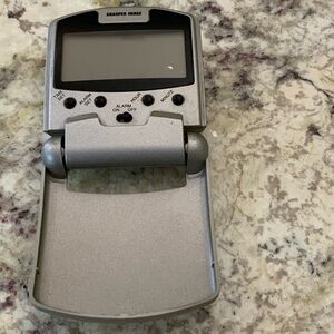 Sharper Image Silver Folding Travel Alarm Clock with LCD